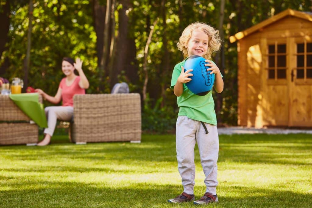 Boy holding rugby ball